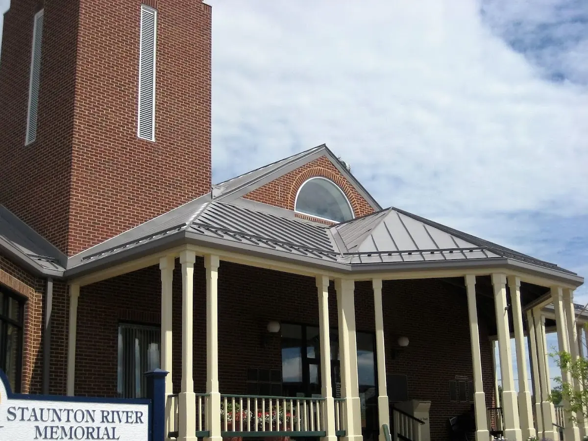 Skilled roofing craftsmen working on a residential roof in Cincinnatus